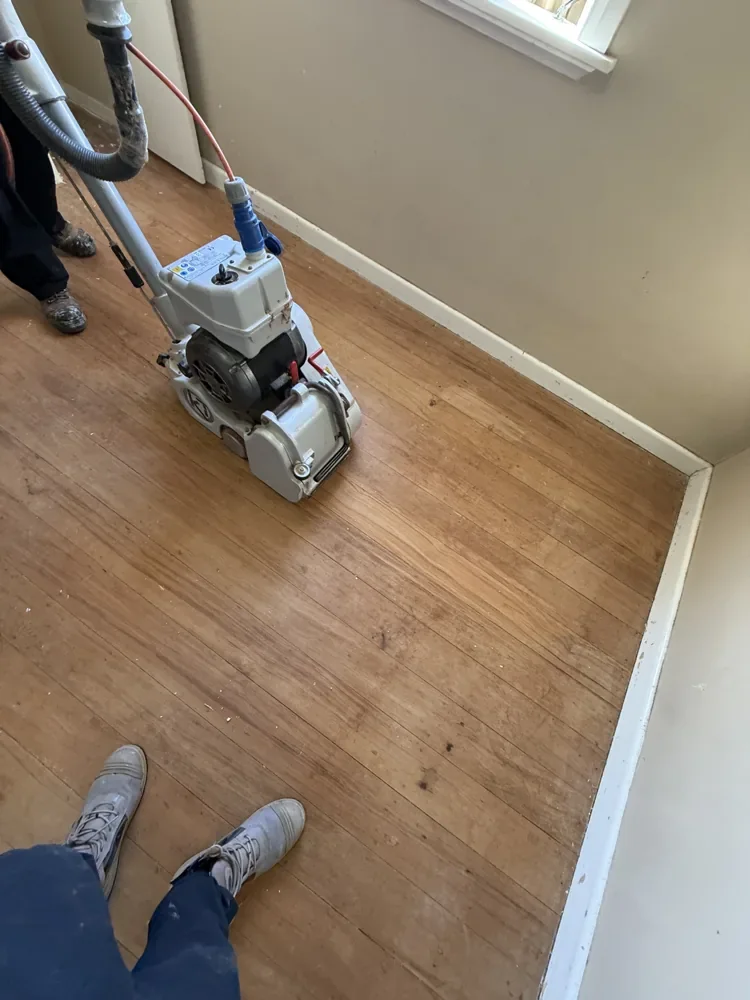 Timber Floor Restoration — Henderson — Machine sanding in progress