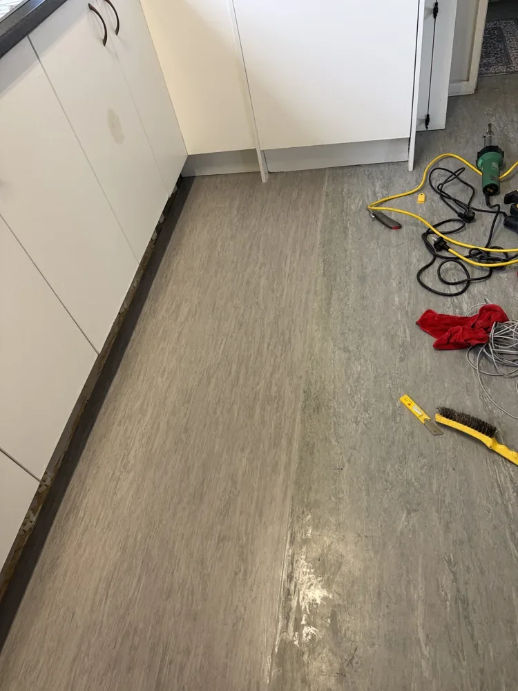 Vinyl Subfloor Repair — Massey — Vinyl installation in progress